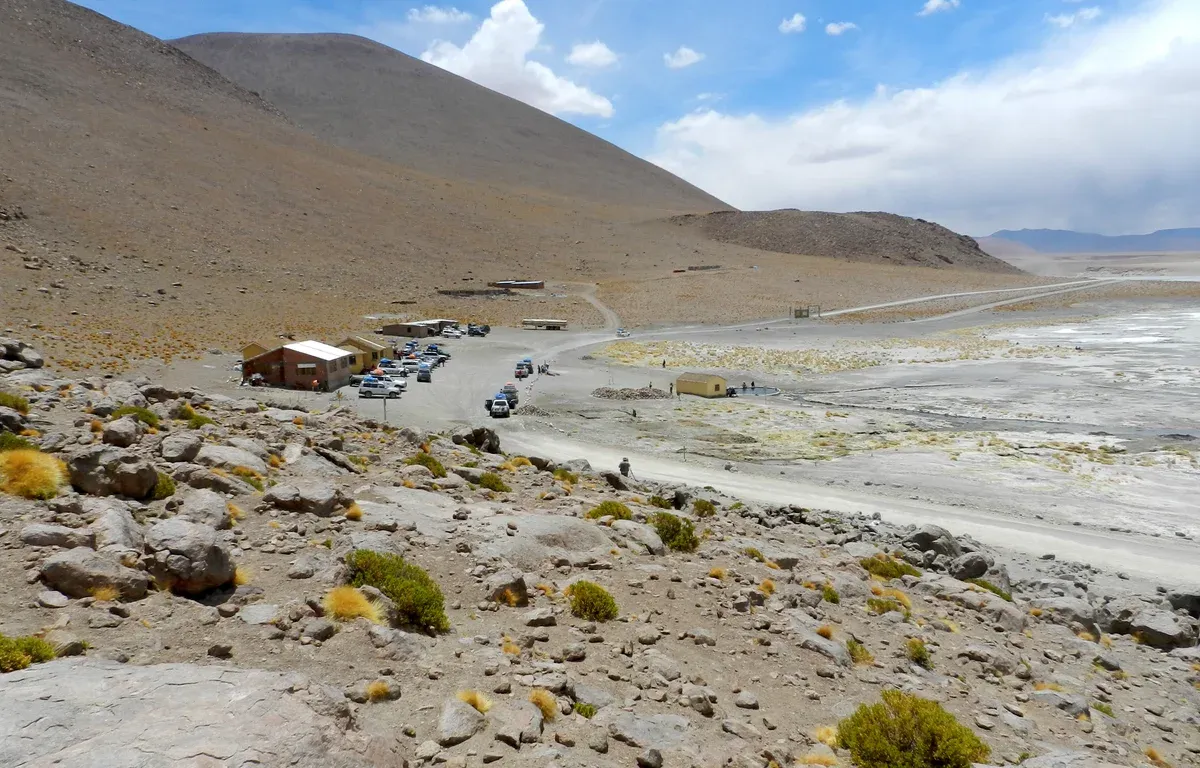 The Polques hot springs car park and pool on a three-day Uyuni salt flats tour